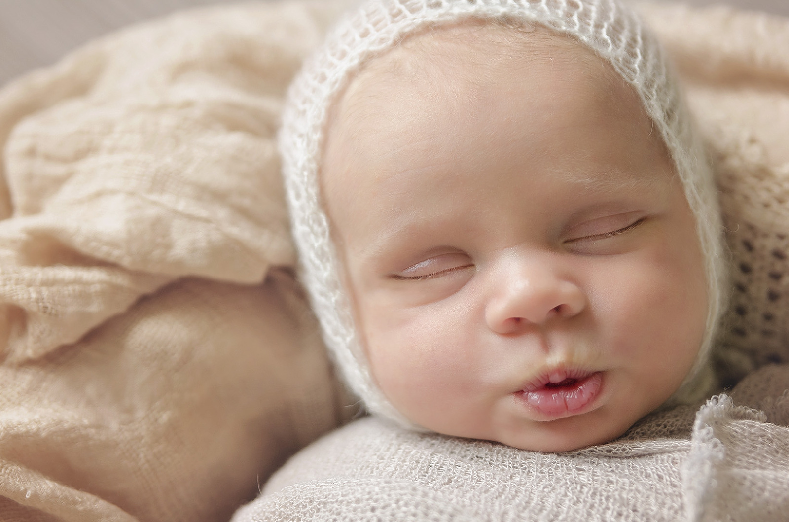 Baby boy in white bonnet Jessie Lee Photography Newborn Photographer Pompano Beach South Florida